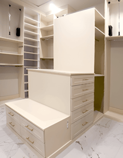 Image of drawer systems in a closet being constructed.