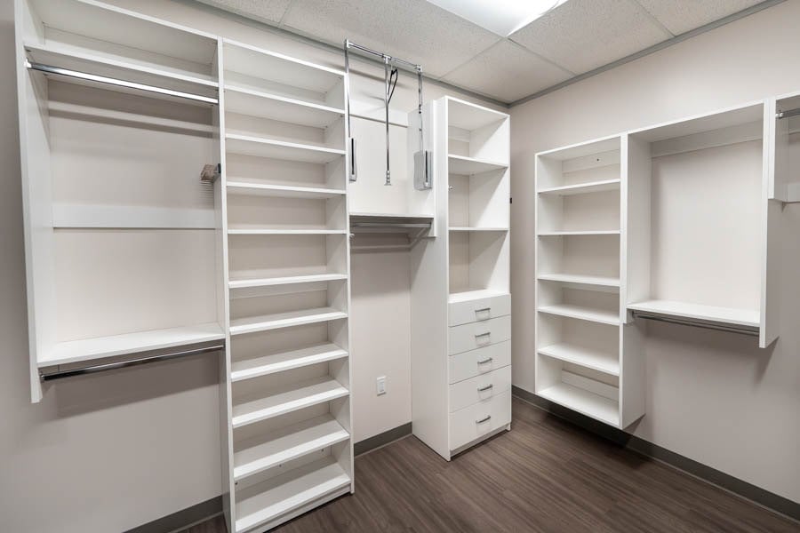 Image of a hybrid custom closet system and a wall-hung custom closet system with built-in shelving.