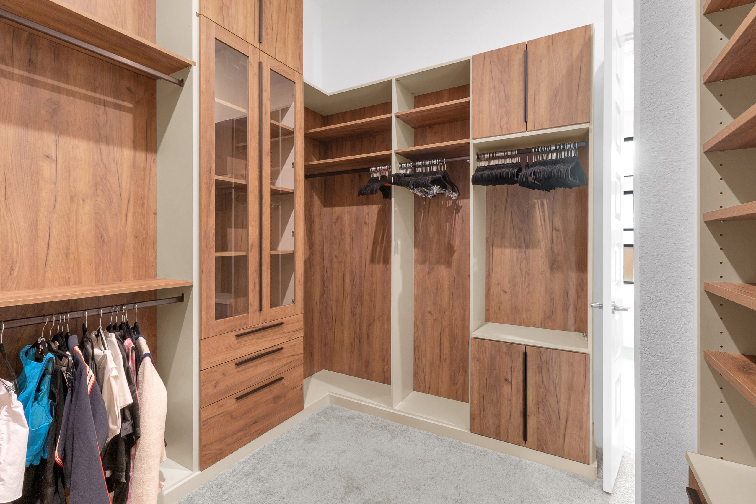 A high-end master closet designed, manufactured, and installed by SpaceManager Closets