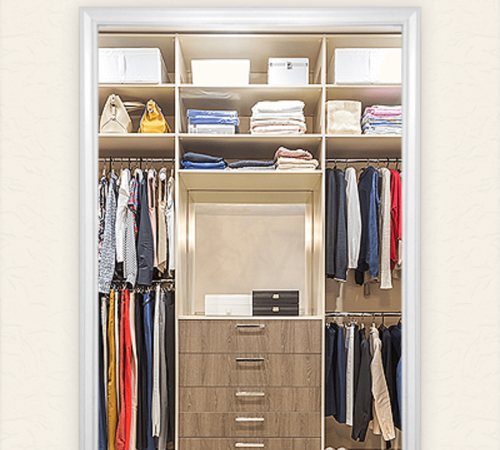 Brown cabinets, shelving space, and hanging space.